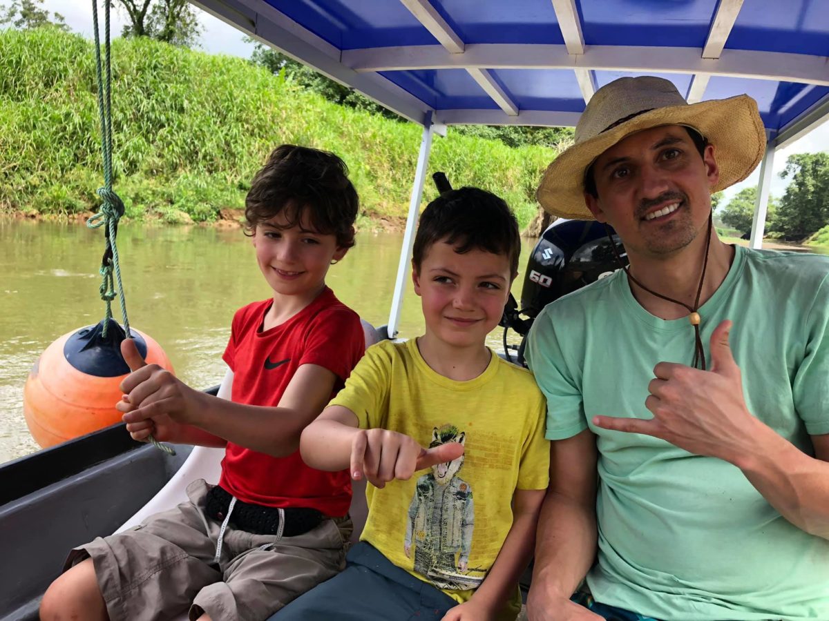 David in a boat with his 2 sons